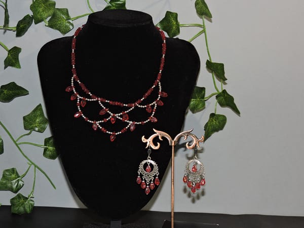 Parure collier et boucle d'oreille cristal rouge
